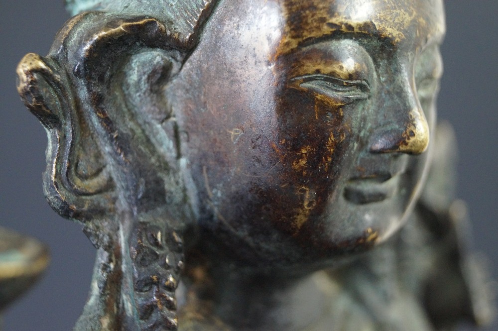 Chinese Buddha figure made of bronze motif close-up 2