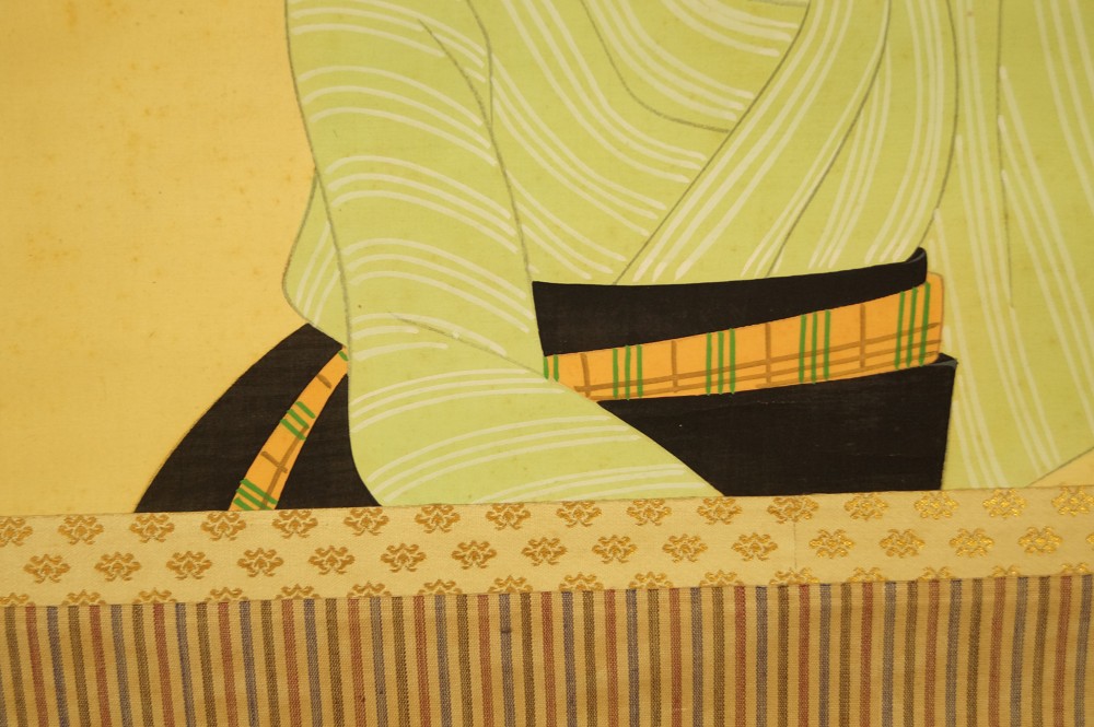 Lady in striped kimono obi motif close-up