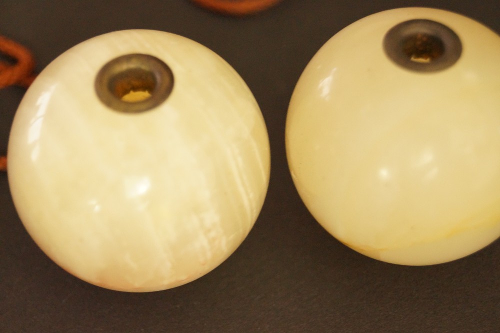 Two Pierced Natural Stone Spheres with Brass Eyelets Stone Close-Up 1