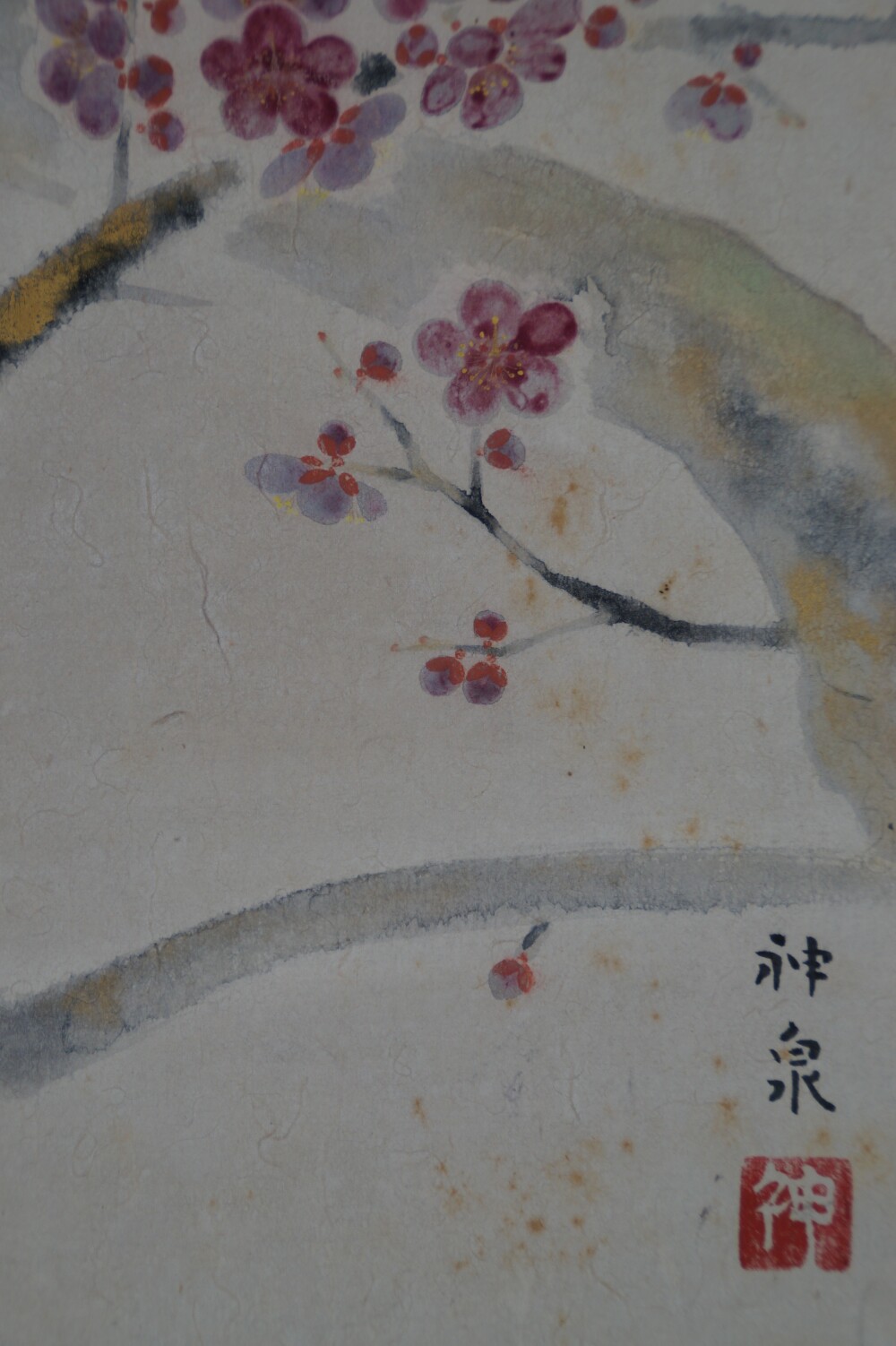 Close-up of the artist's signature Tokuoka Shinsen and the red seal next to plum blossoms in the hanging scroll Plum Blossoms in the Quiet Light of Spring