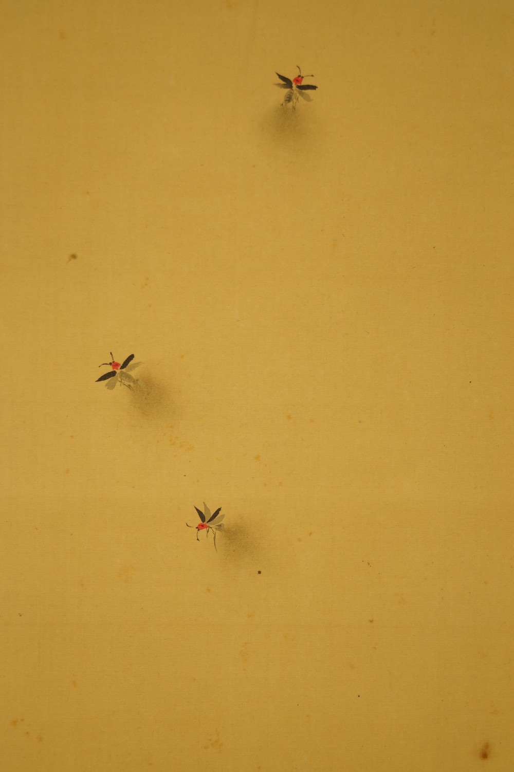Flying fireflies over golden silk ground firefly motif close-up 1