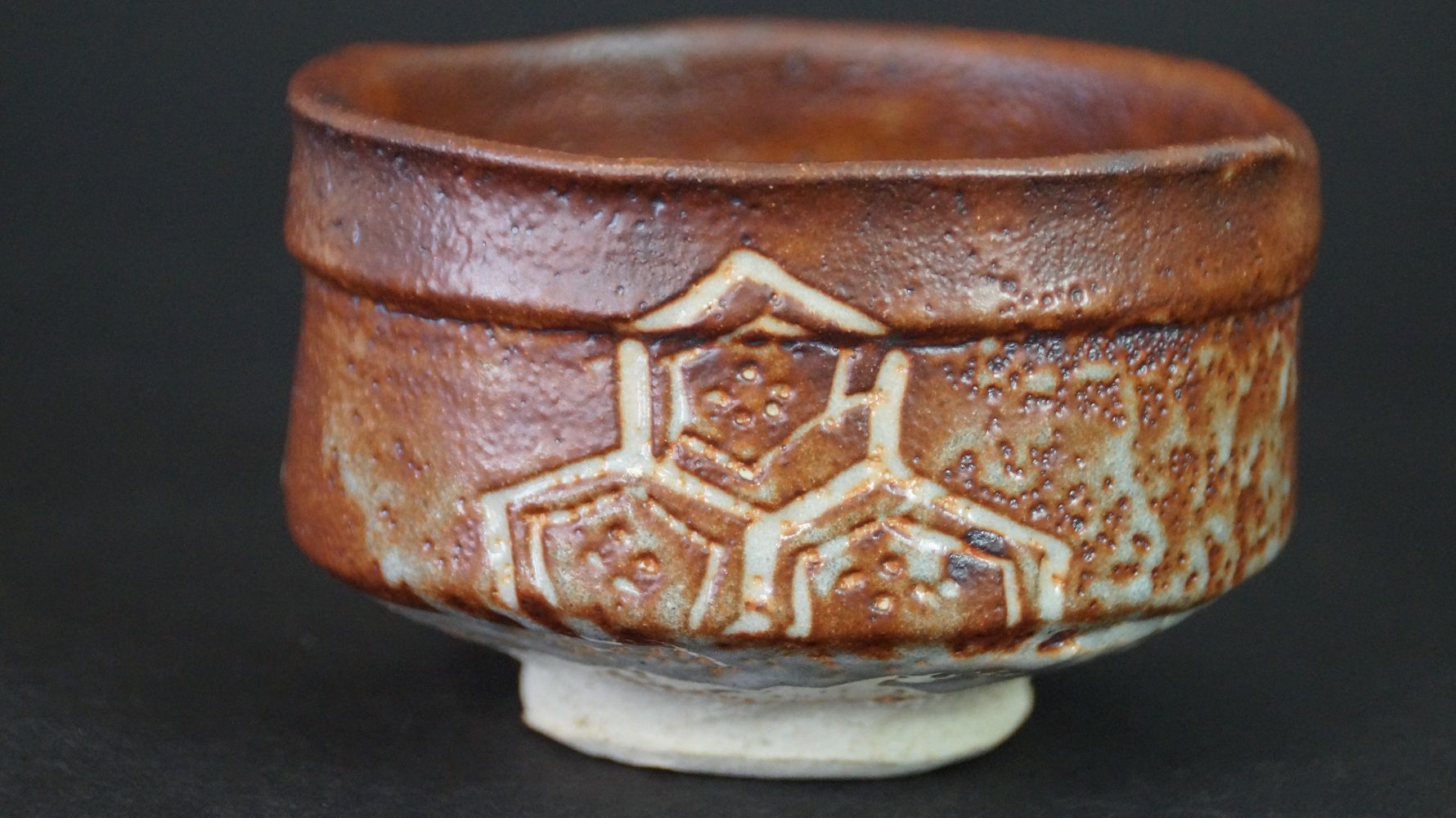 Further view of the chawan tea bowl made of Shino ware with complete hexagon pattern