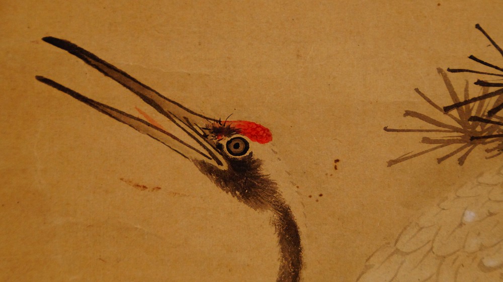 Further close-up of a crane's head with red crown against pine needles by Murata Toho