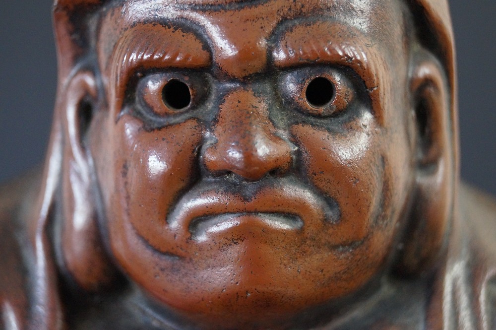 Daruma Figure Made of Bizen Ware Face Close-Up Detail