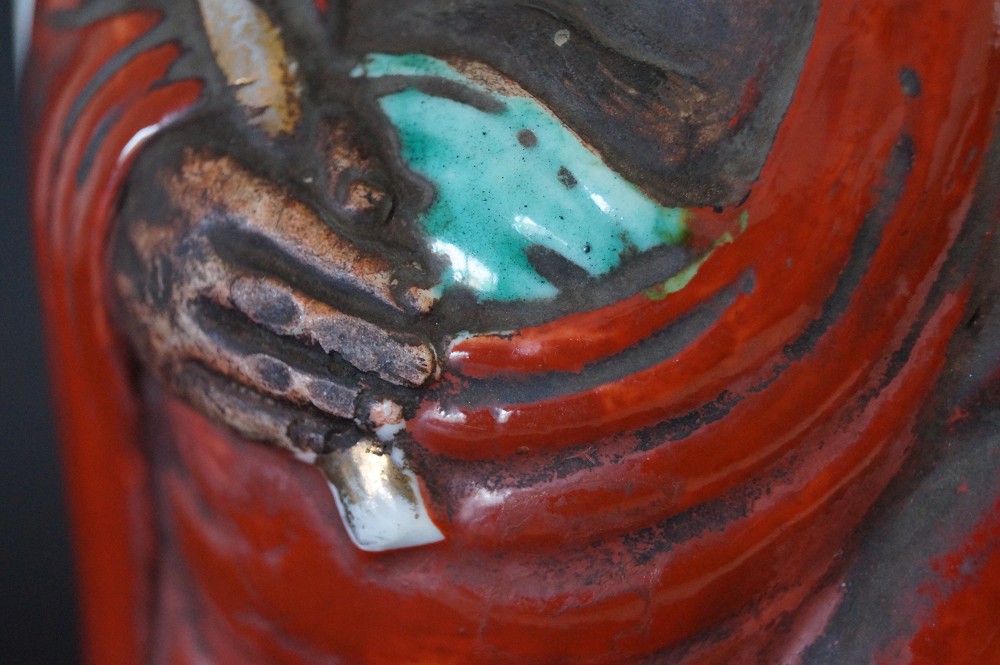 Bodhidharma Daruma figure made of Kutani porcelain hand close-up