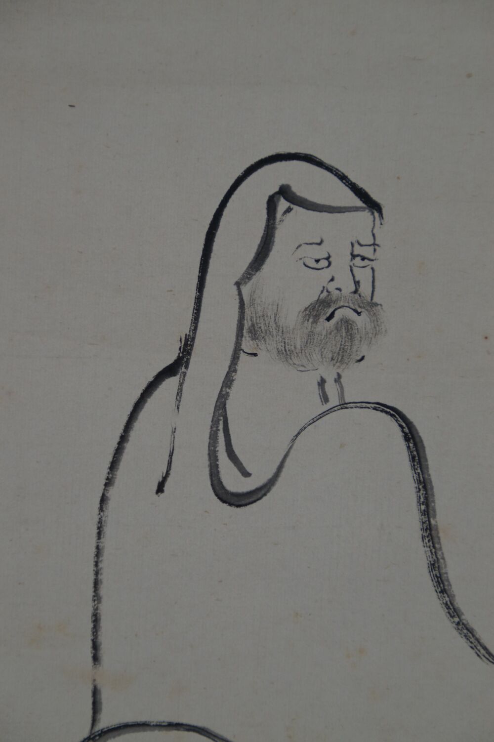 Close-up of Bodhidharma's head in the hanging scroll Bodhidharma Straight to the Heart