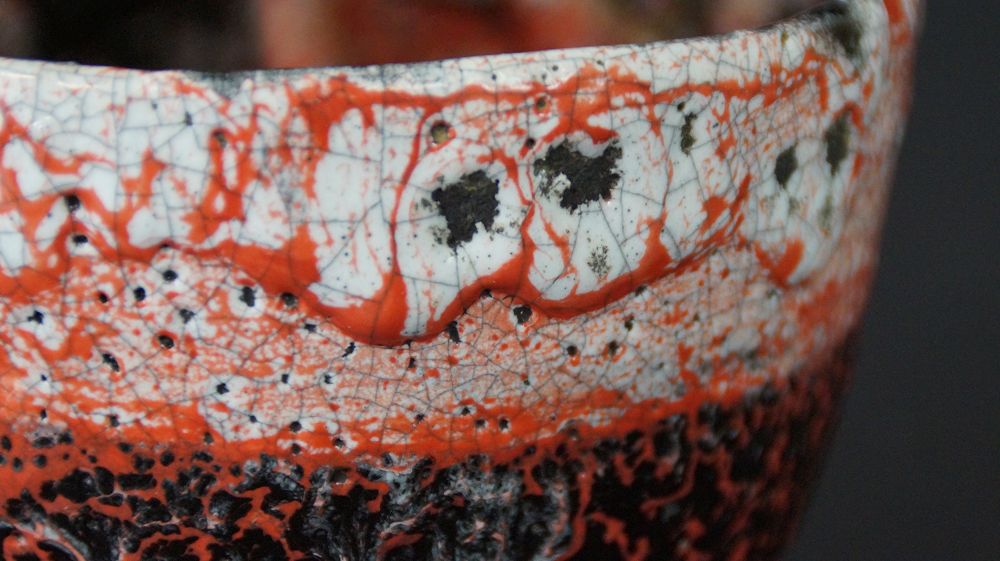Further close-up of the speckled rim of the chawan tea bowl made of Raku ware