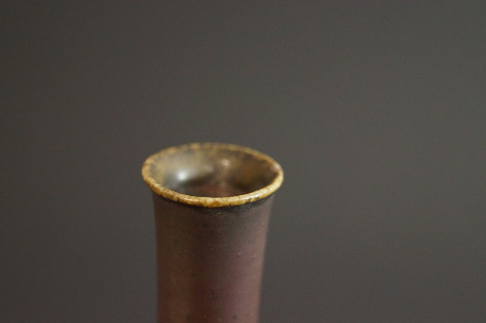 Mouth of the vase from the front with yellowish glaze rim neck view close-up 2
