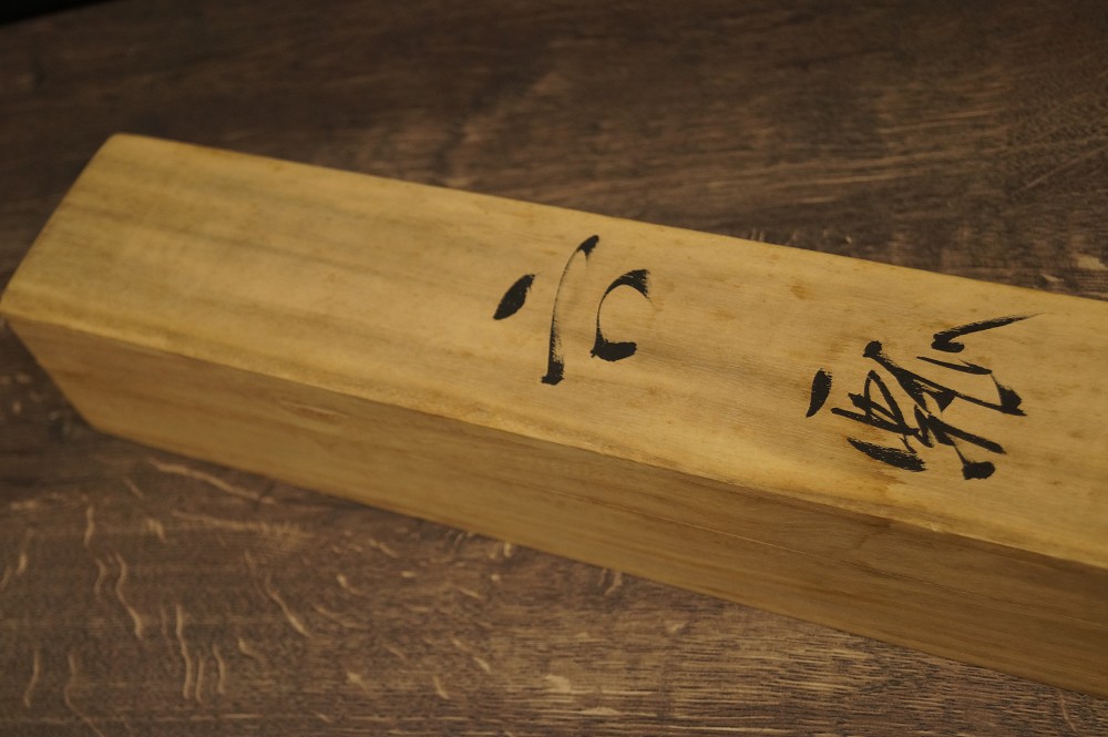 Wooden box with ink inscription storage box close-up
