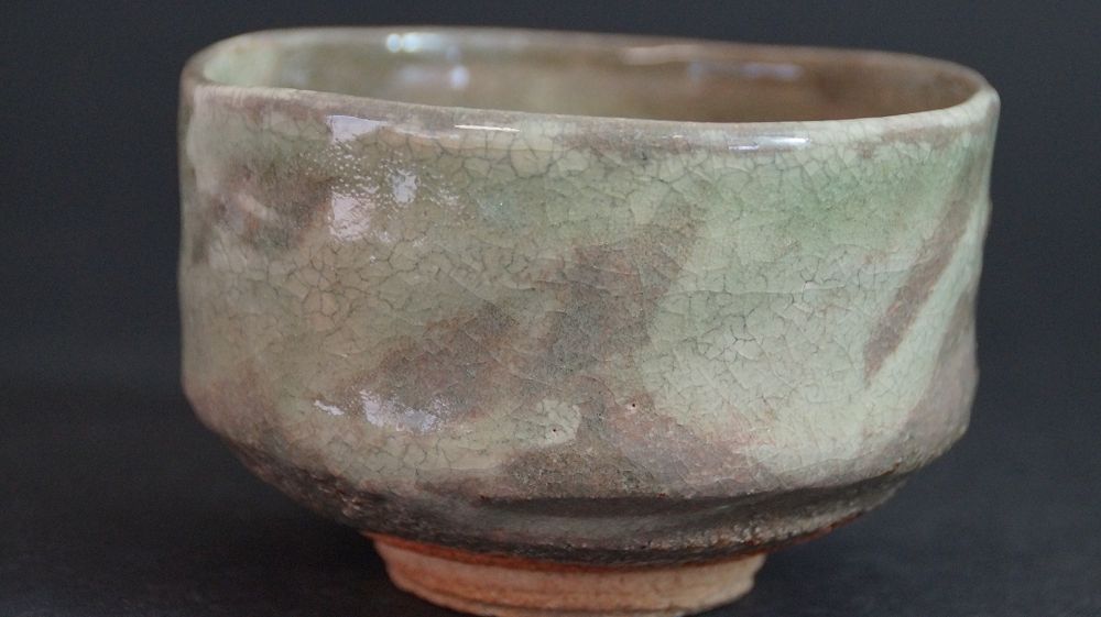 Additional view of the back of the chawan made of Kyoto ware with crackled glaze