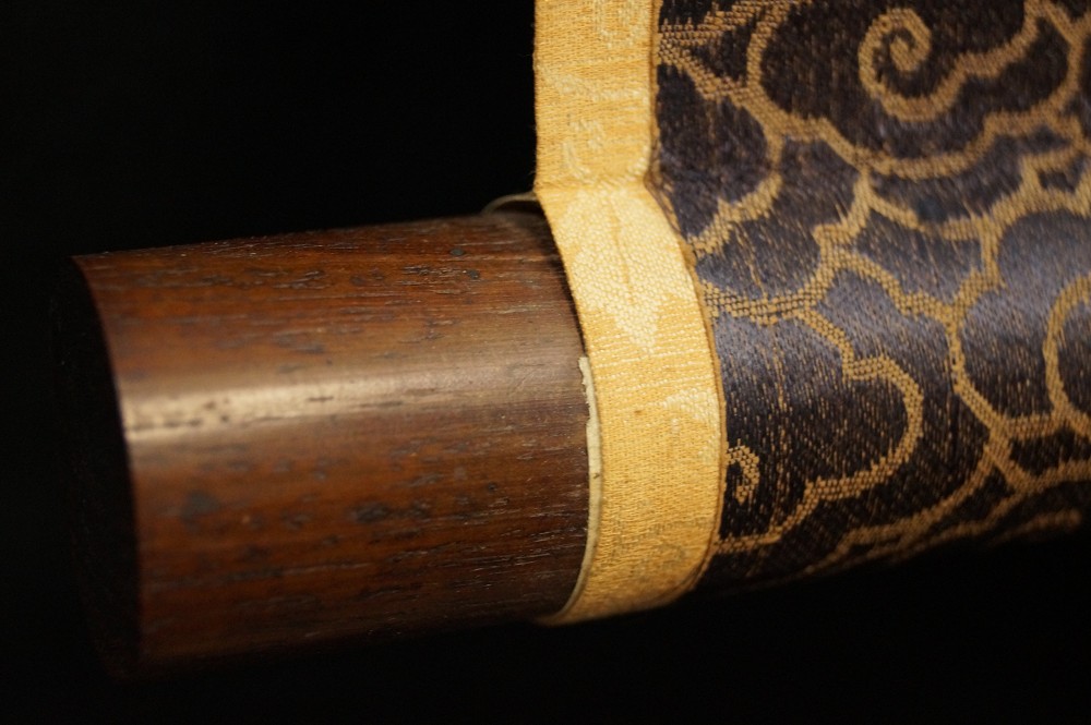 Scroll detail with brocade border close-up