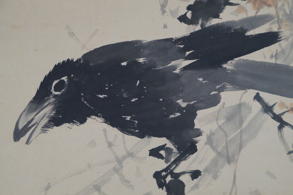 Extreme close-up of the raven's head and plumage in the hanging scroll Raven on Bare Branch by Watanabe Ando