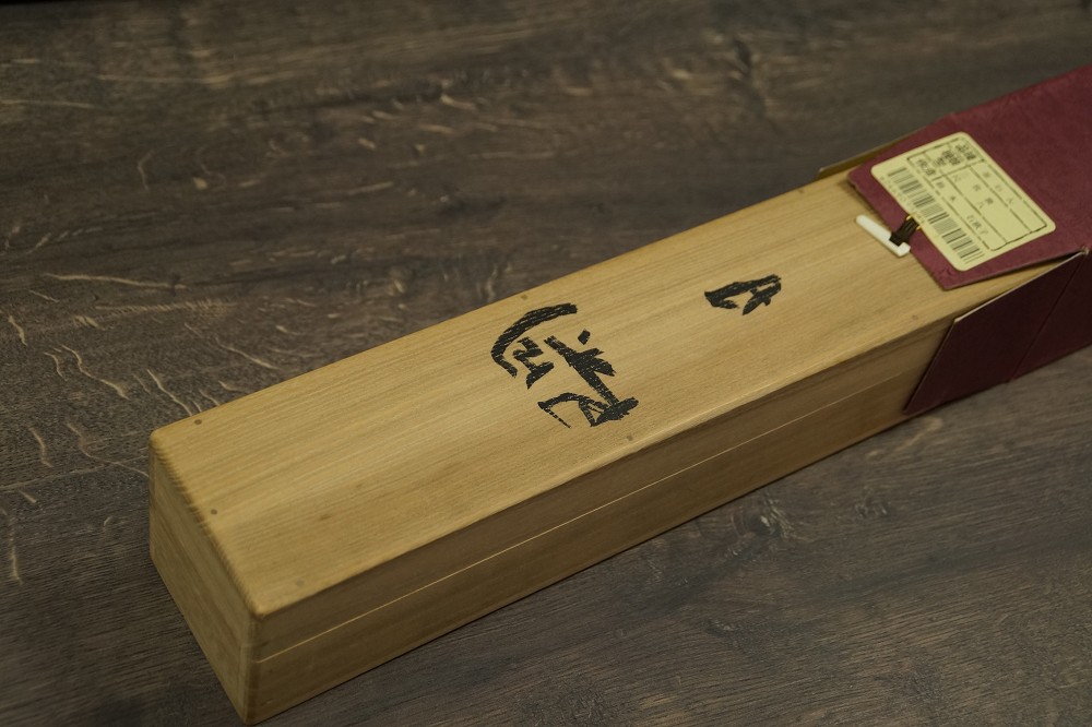 Close-up of the wooden storage box with ink inscription