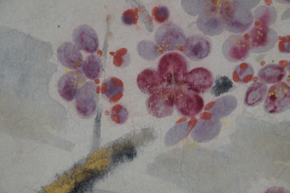 Extreme close-up of the pink and violet blooming plum blossoms in the Kakemono Plum Blossoms in Quiet Spring Light by Tokuoka Shinsen