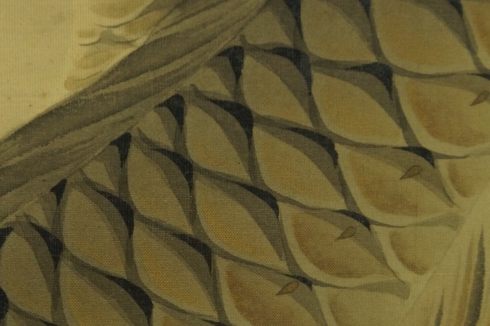 Close-up of the precisely rendered scale pattern in gold and brown tones