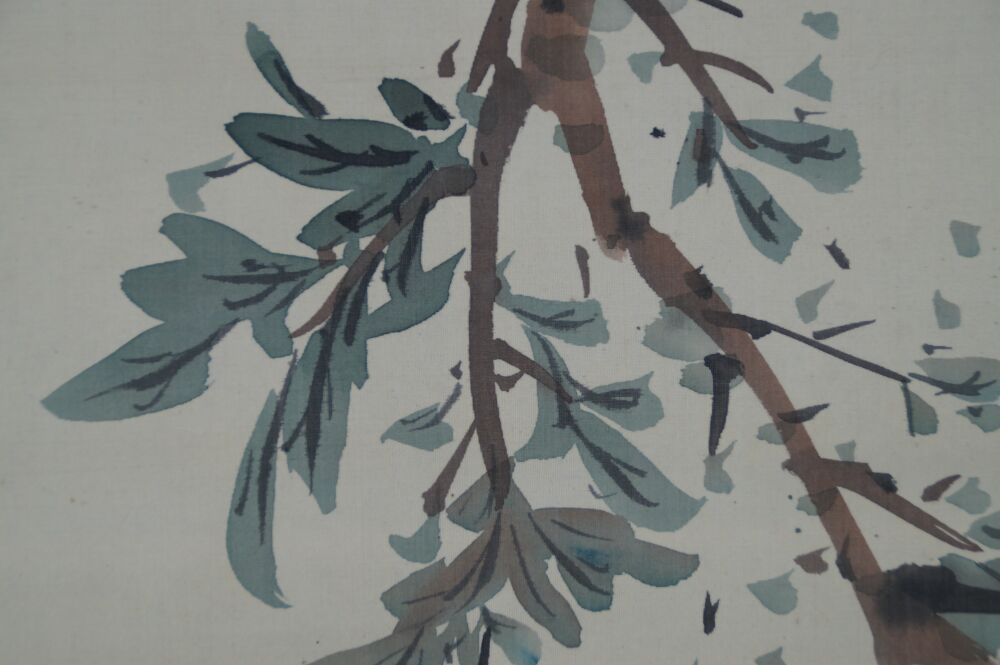 Detail view of the branches and leaves of the pomegranate tree in the Pomegranate Branch and Starling hanging scroll