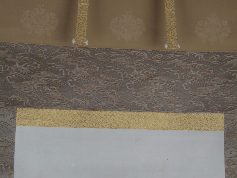 Detail view of the silk mounting with wave pattern and gold band of the Kakemono Set Landscapes in Ink