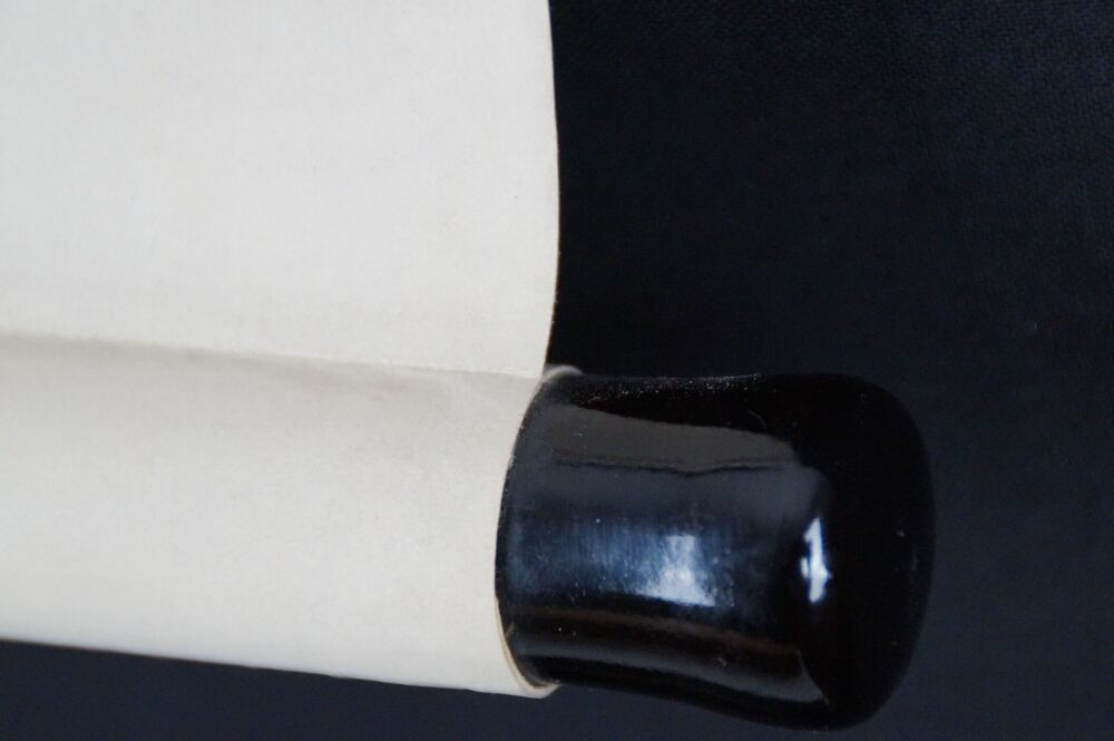 Detail view of the black-lacquered scroll end of the Kakemono Bodhidharma Straight to the Heart