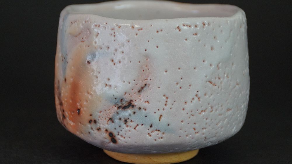 Another view of the chawan made of Shino ware with orange and blue glaze gradient