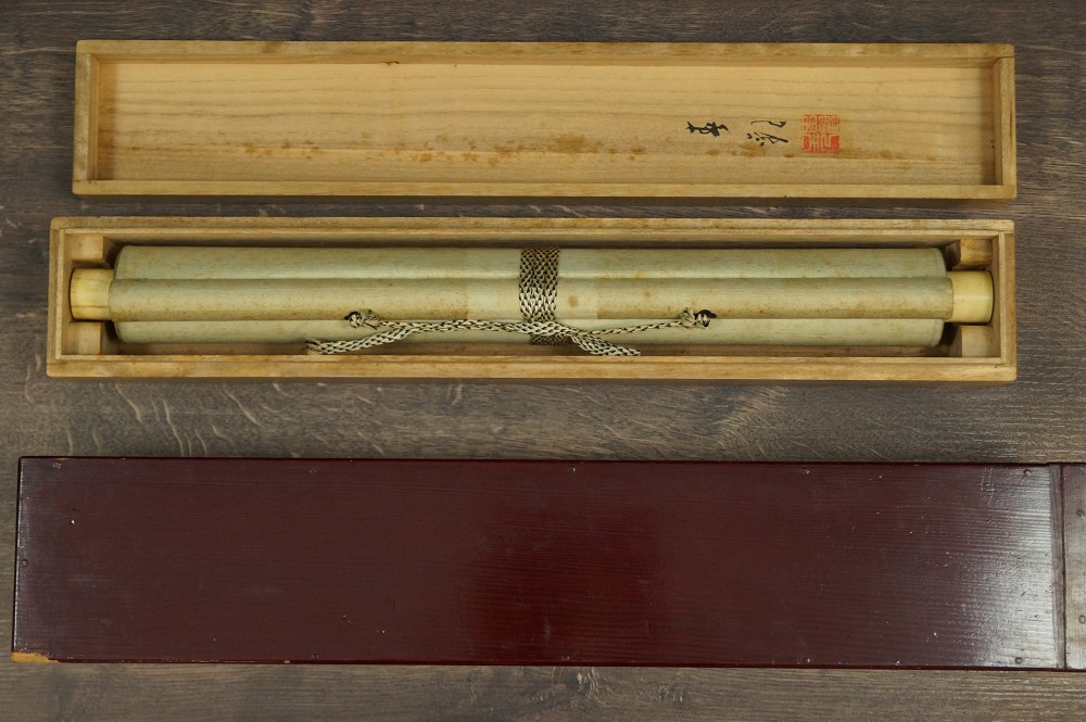Owl hanging scroll rolled up in storage box