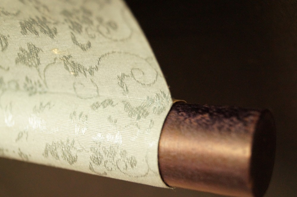 Crow on a branch scroll roller detail