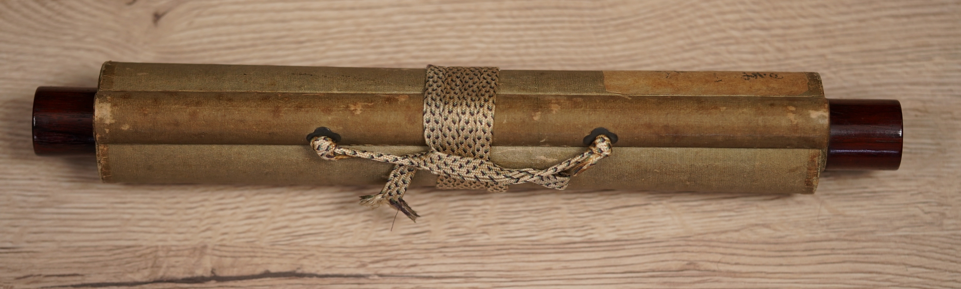 Detail View of the Rolled-Up Hanging Scroll with Closure Cord and Lacquer Knobs of the Hanging Scroll Songbird on Blossoming Plum Tree