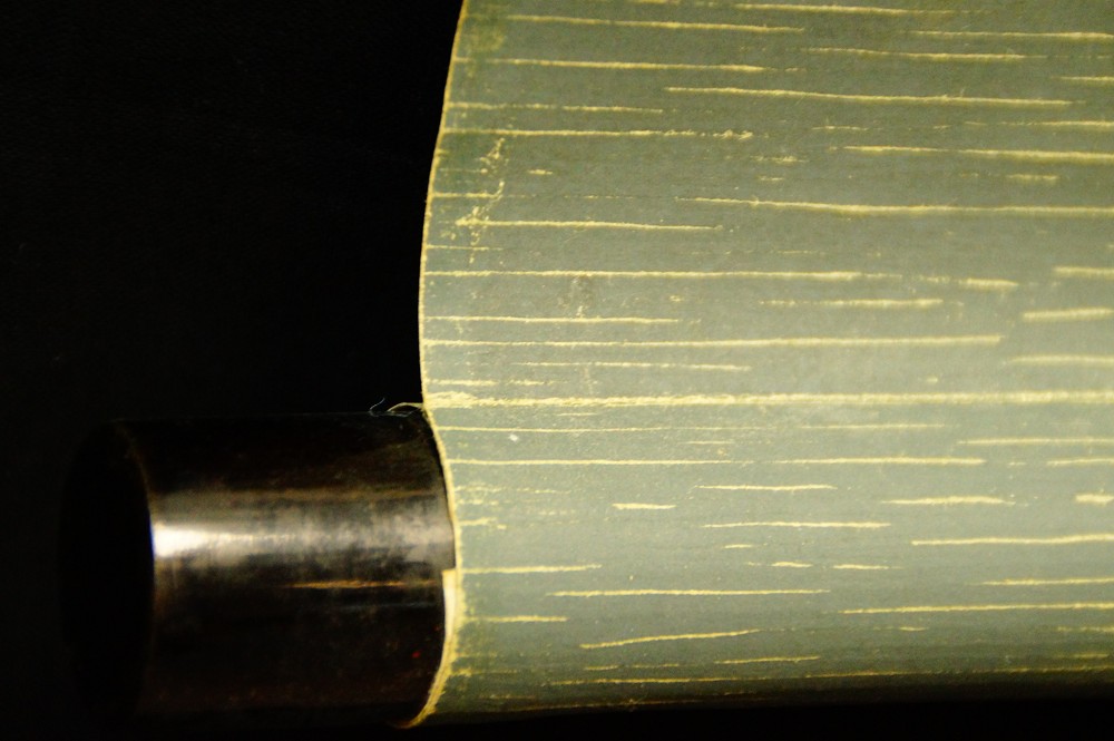 Close-up of the wooden jikusaki at the end of the scroll
