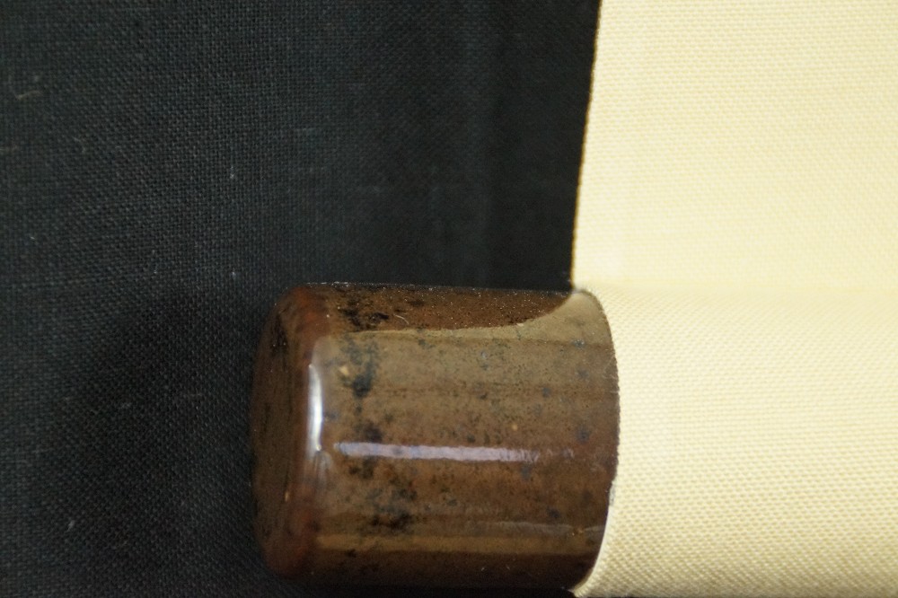 Close-Up of the Ceramic Jikusaki at the End of the Scroll