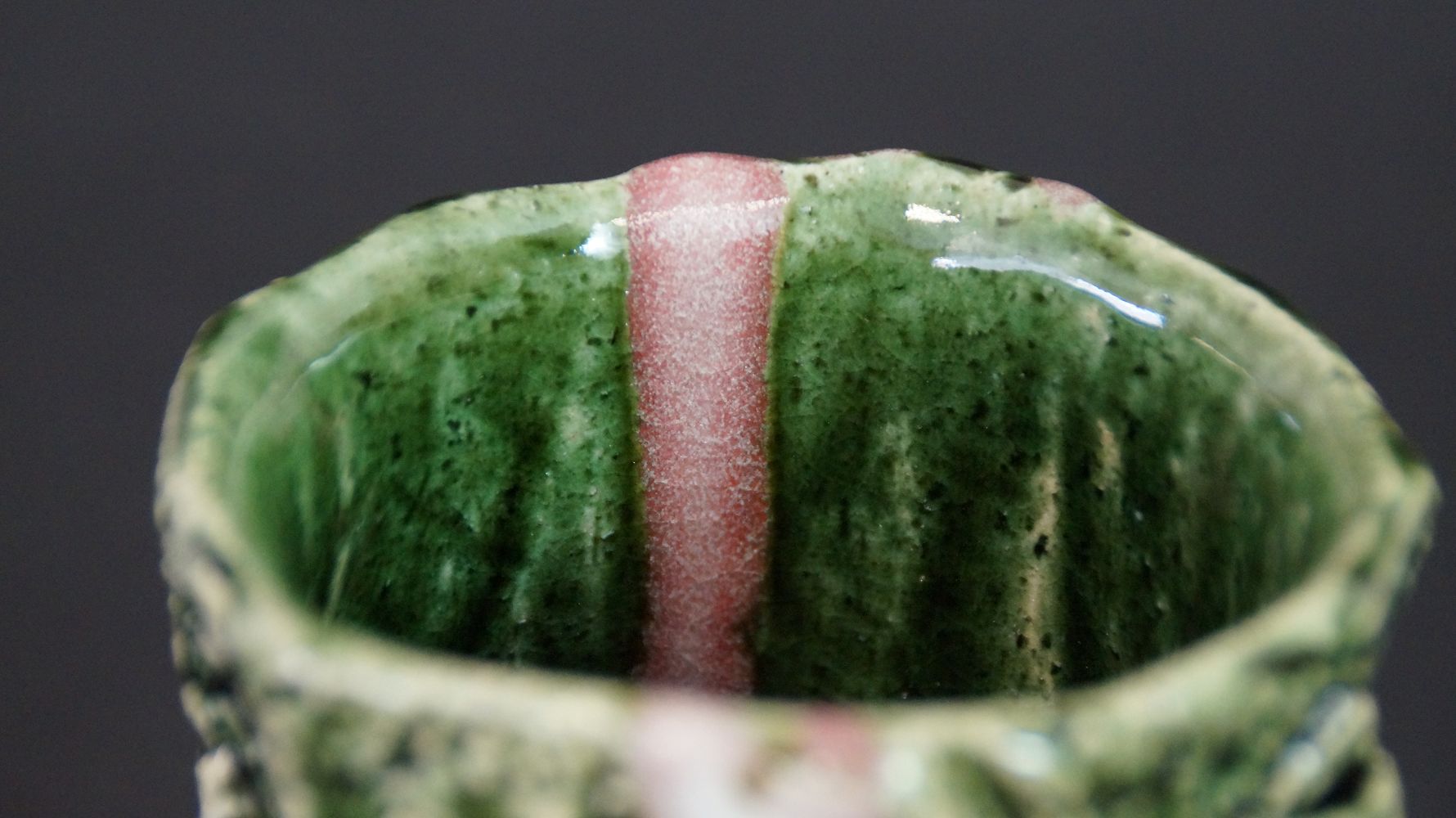 Close-up of the green interior glaze with pink stripe of the Yunomi tea bowl made of Oribe ware
