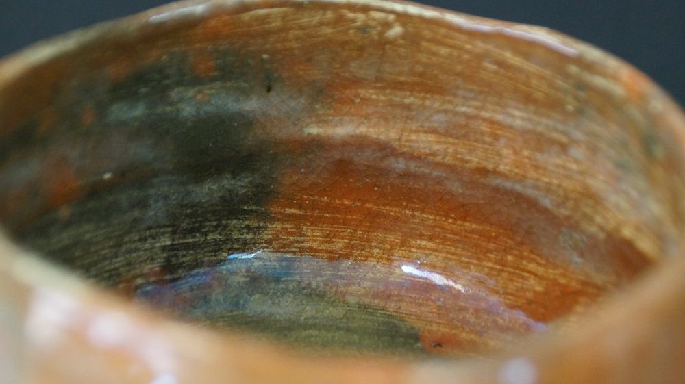 Further close-up of the interior glaze at the rim of the Chawan tea bowl made of Raku ware