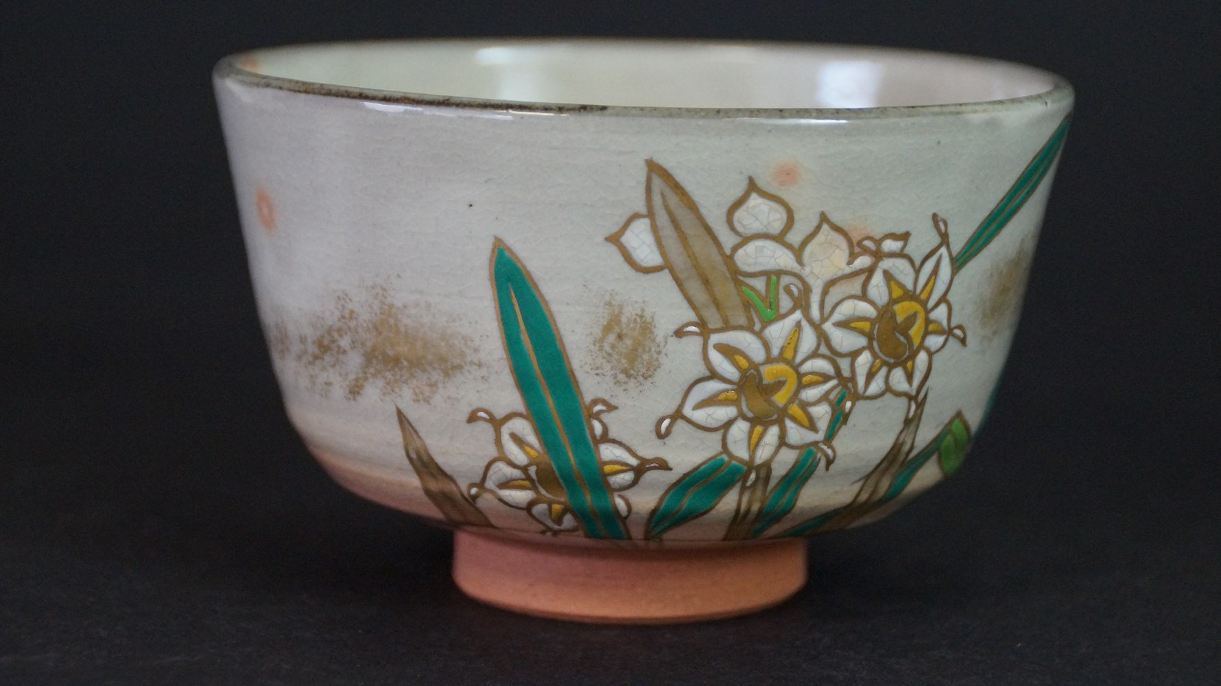 Another view of the chawan tea bowl made of Kyoto ware with gold-outlined narcissus motif
