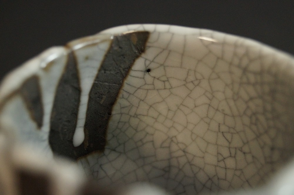 Extreme close-up of the crackled white Shino glaze glaze close-up