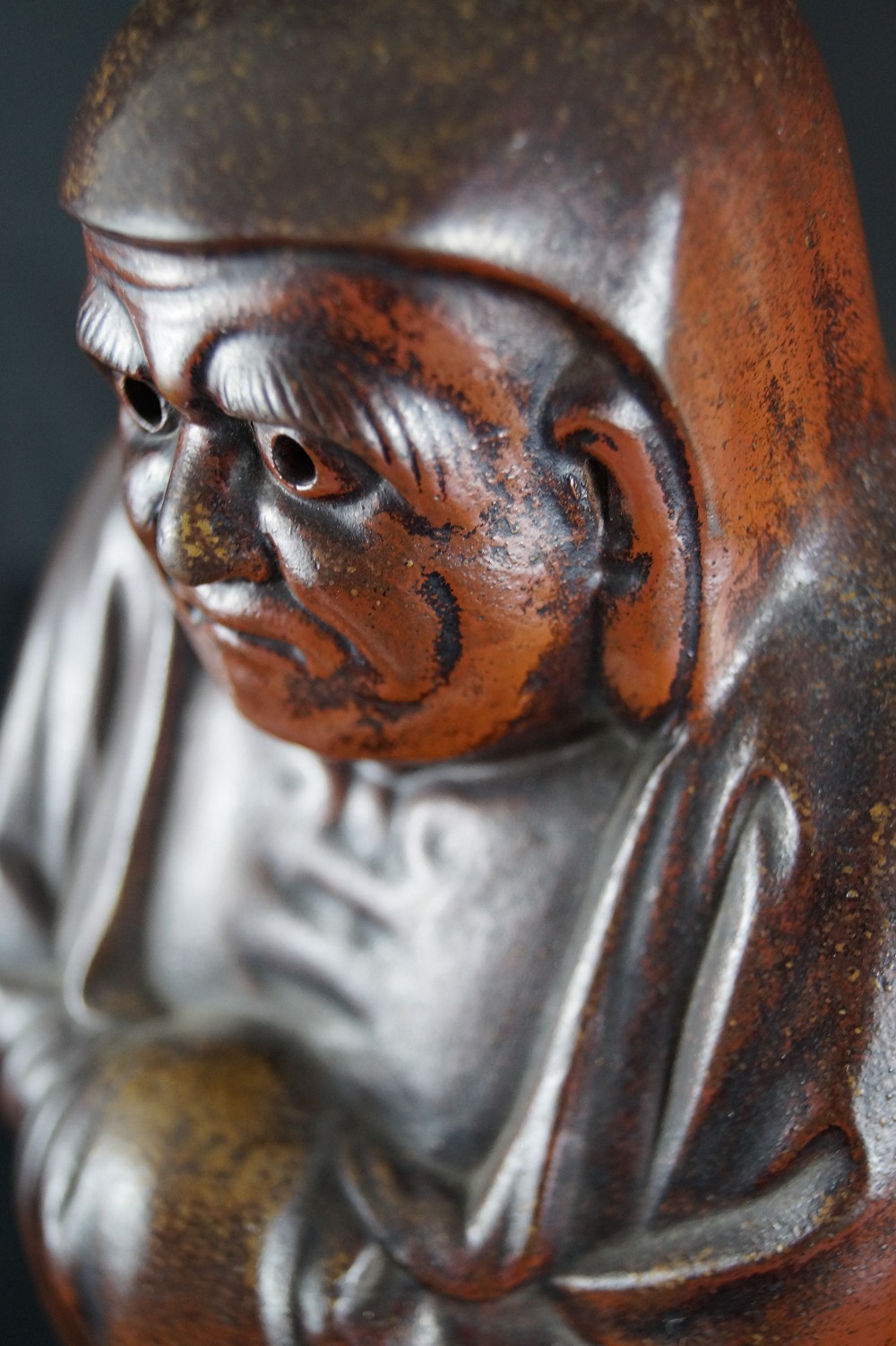 Bodhidharma Daruma wide-open eyes Bizen ware face close-up 1