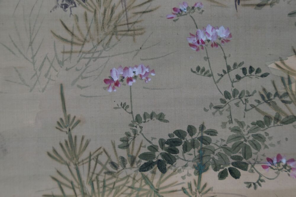 Close-up of the pink bush clover blossoms and autumn grasses in the kakemono