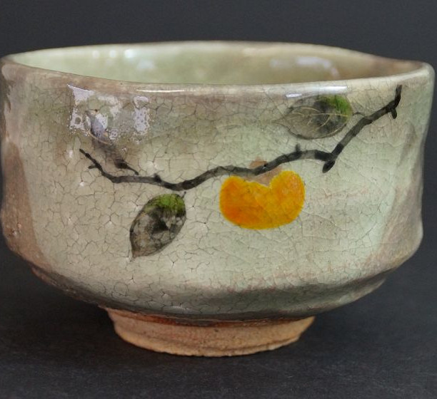 Chawan made of Kyoto ware by Seizan Hoki with hand-painted persimmon branch and crackled glaze