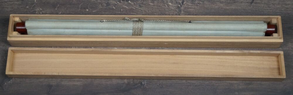 Opened Storage Box with Rolled Up Kakemono Tiger on Rocks