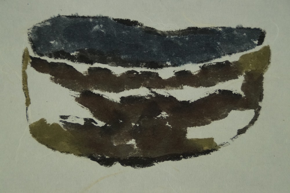 Close-up of the sketchily painted tea bowl with loose brushwork