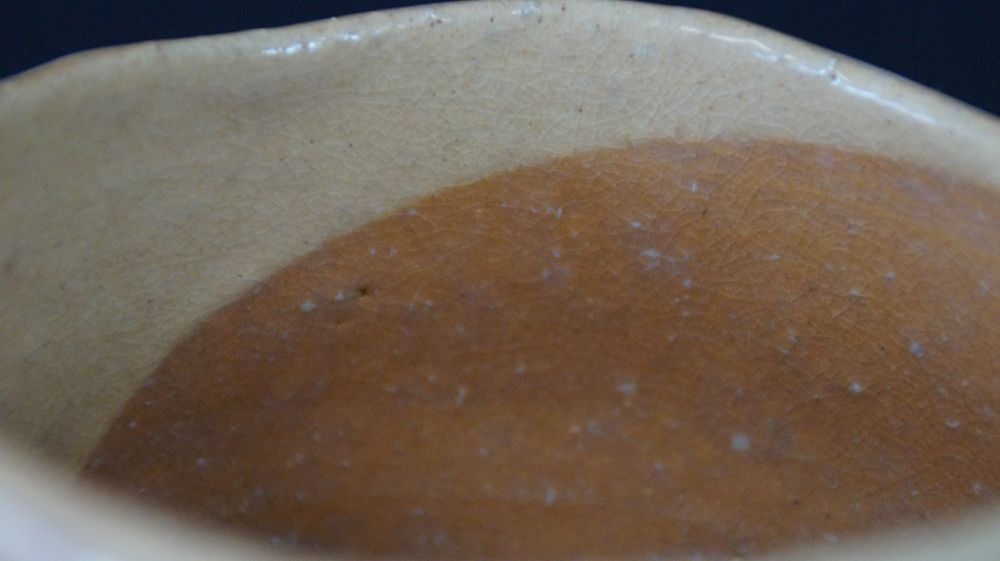 Close-up of the two-color interior glaze of the chawan tea bowl made of Raku ware