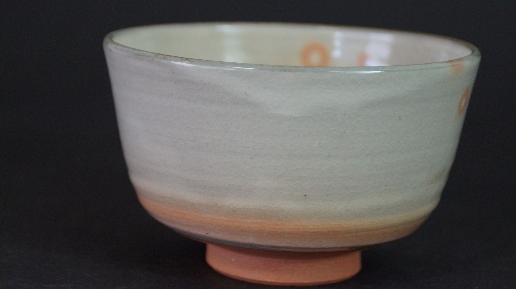Back of the chawan tea bowl made of Kyoto ware with orange dot pattern