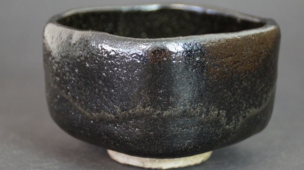 Additional view of the chawan made of Raku ware with iridescent black glaze surface