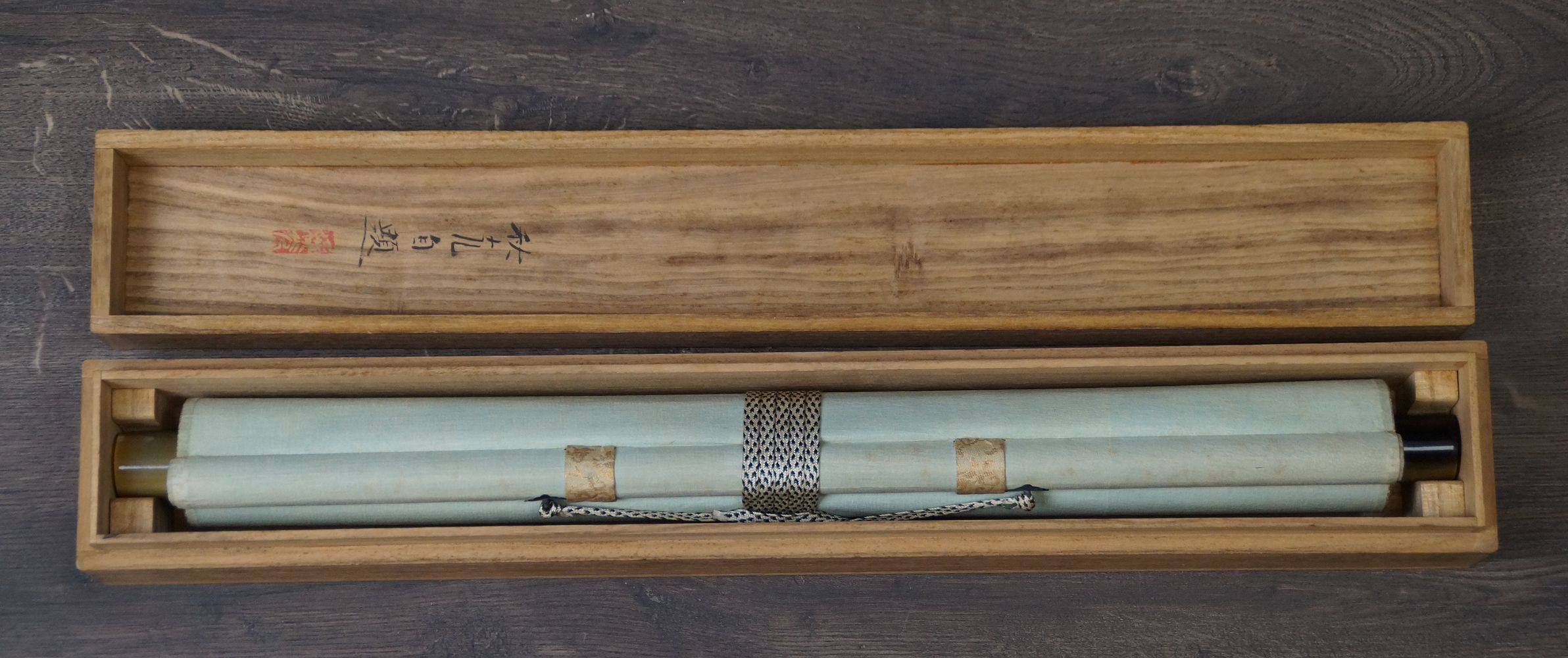 Rolled-Up Kakemono Nightingale on Blossoming Plum Branch in the Open Storage Box