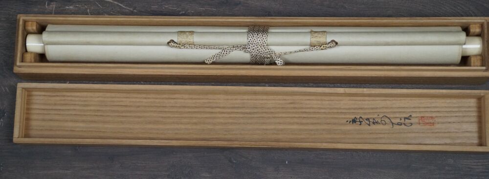Opened storage box with rolled-up Kakemono Birds in Autumn Maple
