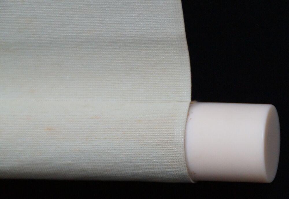 Detail view of the scroll end with ivory knob and cream-colored silk of the hanging scroll calligraphy Shoaku Makusa