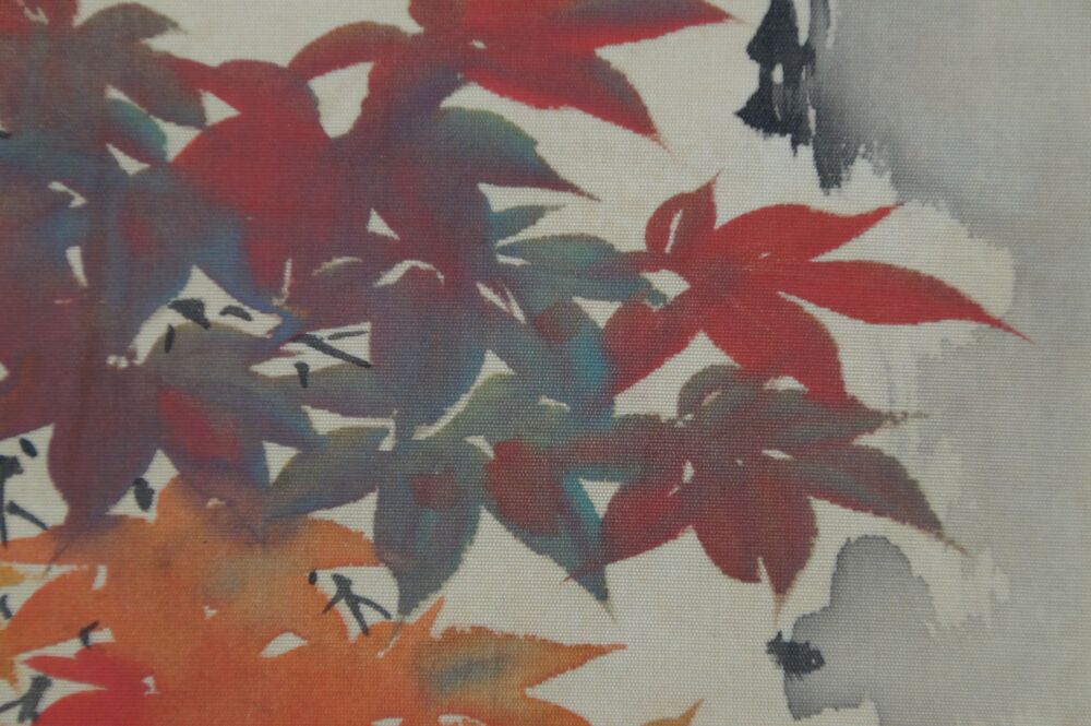 Close-up of the colorful red and green maple leaves in the Kakemono Birds in Autumn Maple