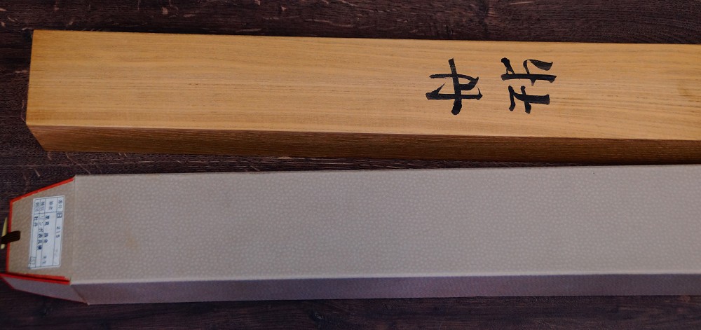 Close-up of the ink inscription Botan on the storage box made of kiri wood