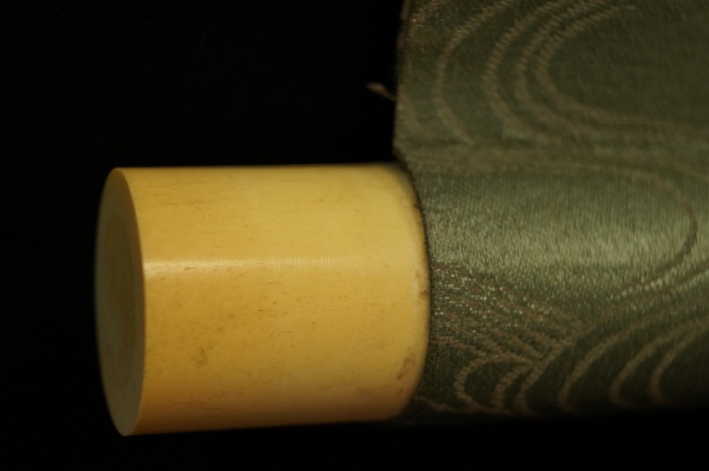Bird on a maple branch scroll detail