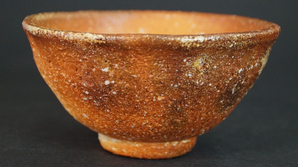 Another view of the chawan made of Shigaraki ware with speckled surface and light-colored rim
