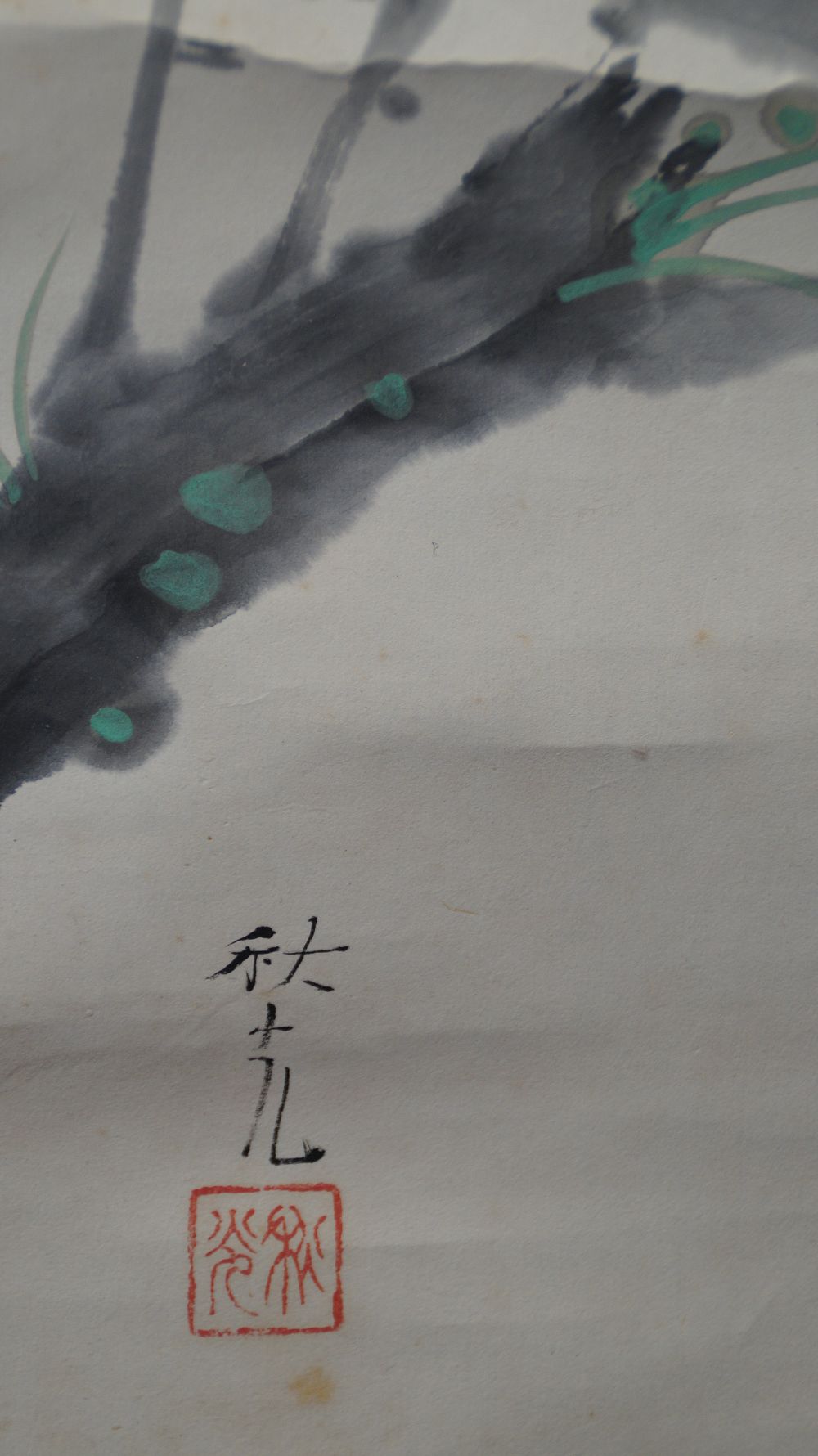 Close-up of the gnarled, moss-covered plum tree trunk in the kakemono Nightingale on Blooming Plum Branch